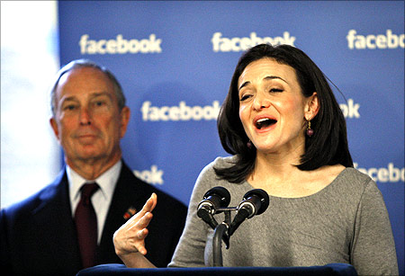 Facebook's Chief Operating Officer (COO) Sheryl Sandberg (R) speaks to the media next to New York City Mayor Michael Bloomberg.