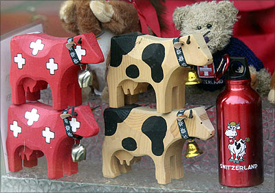 Souvenirs are seen in a shop window in Davos.
