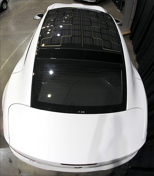 A solar panel is seen on the roof of a Fisker Karma luxury plug-in hybrid car.