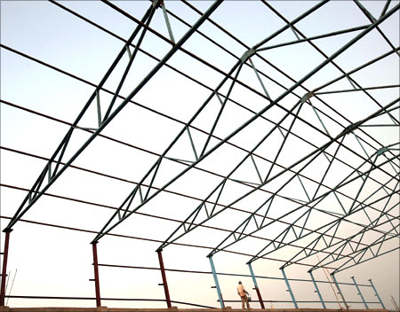 A labourer works at a factory under construction at Hajipur industrial park on the outskirts of the eastern Indian city of Patna.