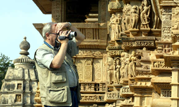 A tourist takes pictures of Khajuraho in Madhya Pradesh.