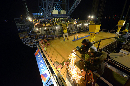 Employees work on a bridge undergoing construction, to link Russia's far eastern city of Vladivostok with Russky Island.