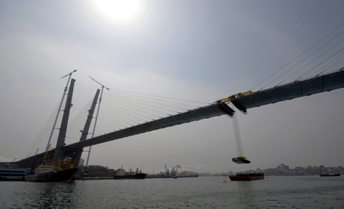 The final section is installed to complete the bridge across the Golden Horn bay in Vladivostok.