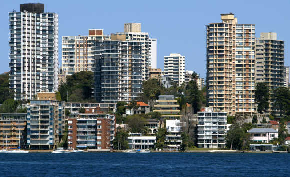 Luxury houses and apartments with multi-million dollar price tags tower over Sydney Harbour.