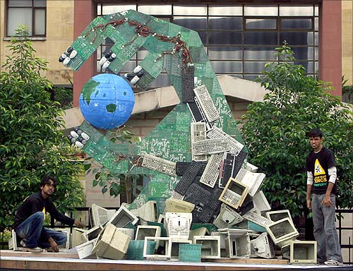 Greenpeace activists set up an art installation made of dismantled computers to send a message on hazardous electronic waste.