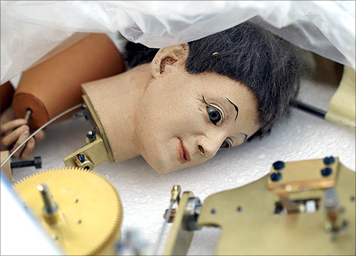 The head of an automaton is pictured in a box in the workshop of Swiss artisan Francois Junod in Sainte-Croix.