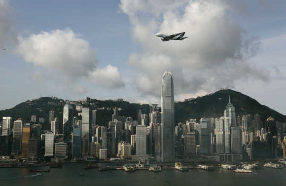 An Airbus A380 flies over Hong Kong's Victoria Harbour in Hong Kong.