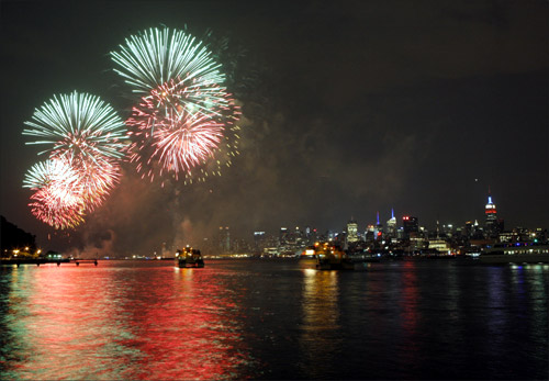 Fireworks explode over the Hudson River and the skyline of New York during the Macy's Independence Day celebration as seen from Hoboken, New Jersey.