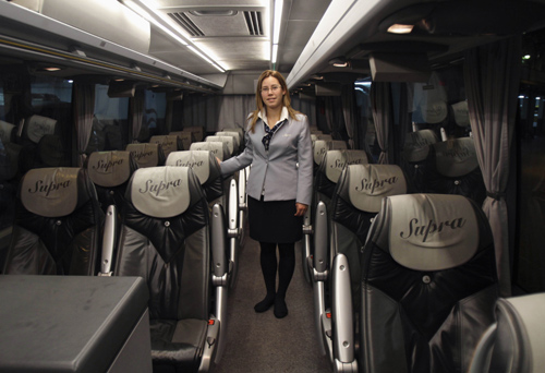 Tania Leon, a 29 year-old stewardess, poses for a picture inside a bus in Santiago de Compostela, Spain.