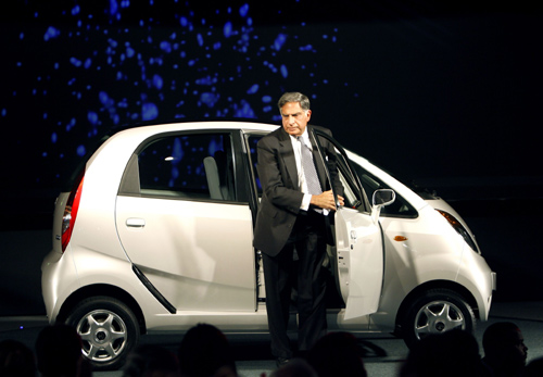 Ratan Tata, steps out from Nano car during its launch at the 9th Auto Expo in New Delhi.