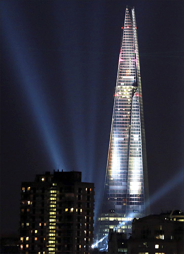 A laser and searchlight show marks the completion of the exterior of the Shard building in central London.