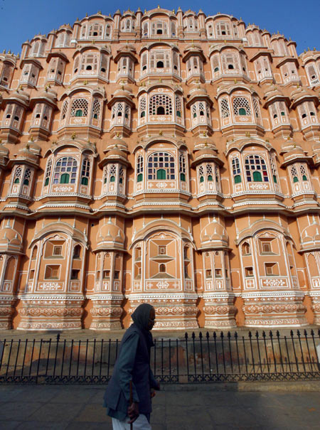 A man walks in front of Hawa Mahal also known as 'Palace of Winds' in Jaipur.