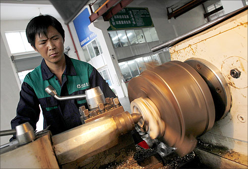A labourer works at a valve factory in Wenzhou, Zhejiang Province.