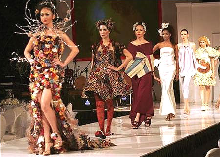 Models present creations made from recycled plastic or organic materials during the Eco Chic Fashion show in Jakarta.