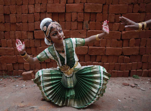 A girl practices Bharatnatyam before a performance in Trivandrum.