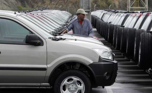 A worker inspects a Ford Ecosport in Brazilian state of Bahia.