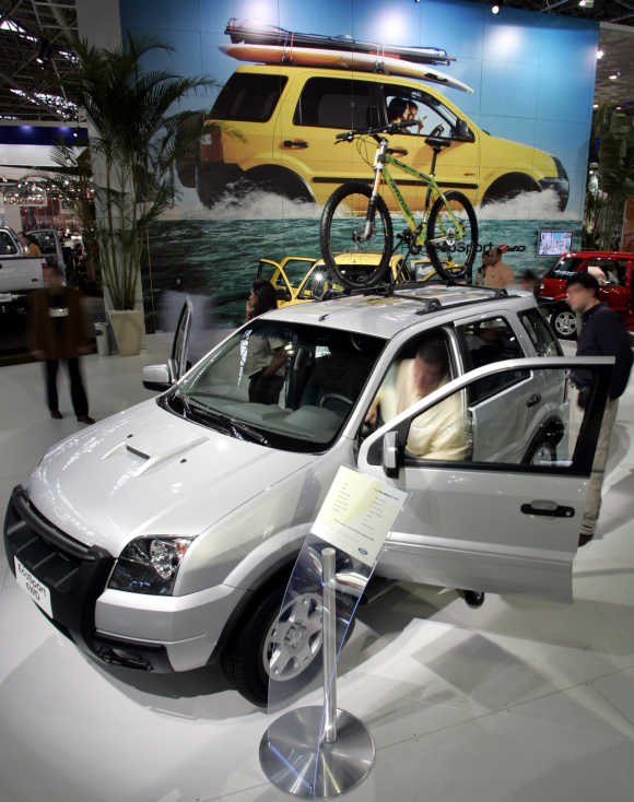 Visitors look at a Ford EcoSport utility vehicle in Sao Paulo, Brazil.