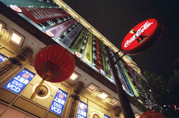 A Coca-Cola sign hangs outside one of Shanghai's biggest department stores.