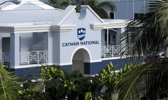 The logo of the Cayman National Bank is pictured on a branch in George Town.