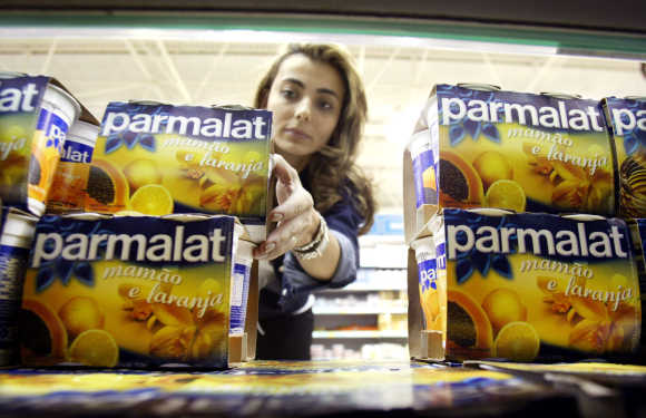 A Brazilian consumer buys a Parmalat product in a supermarket in Sao Paulo.