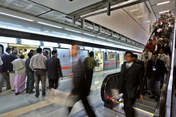 Passengers arrive to an underground metro train station in New Delhi.