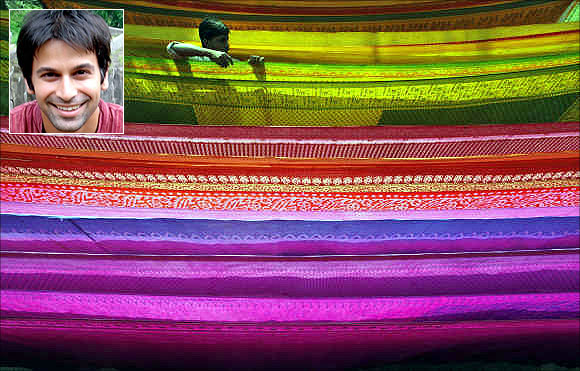 Sandip Sukhtankar, inset. A worker arranges a saree as it is hung out to dry after dyeing it at a workshop in Shardarpara village, south of Kolkata.