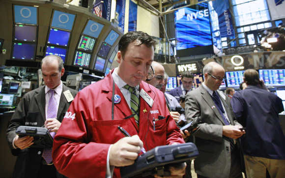 Traders work on floor of the New York Stock Exchange.