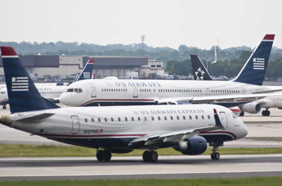 US Airways jets taxi on the tarmac in Charlotte, North Carolina.