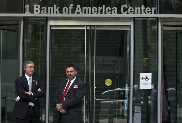 Bank of America security guards stand outside as an annual shareholders meeting takes place in Charlotte, North Carolina.