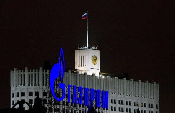 A Gazprom sign is seen in front of the White House, the seat of Russia's prime minister, in Moscow.