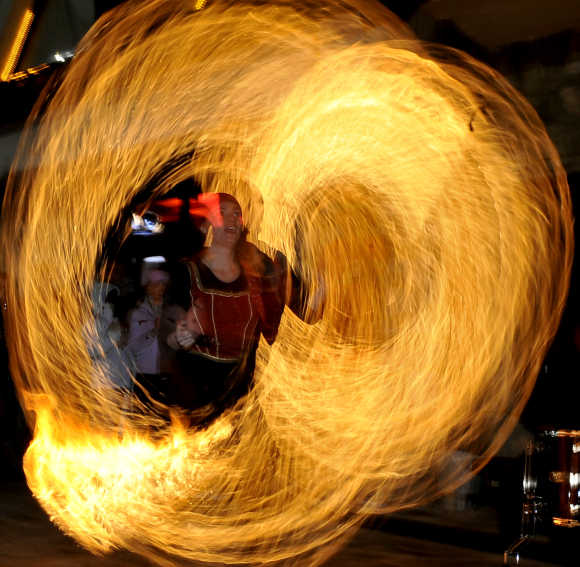 A girl performs a fire show during the winter festival at the Mavrovo ski resort, 100km west from the Macedonian capital of Skopje.