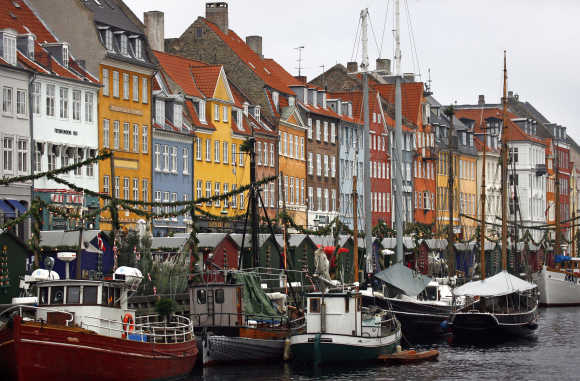 Boats are seen anchored at the 17th century Nyhavn district, home to many shops and restaurants in Copenhagen.