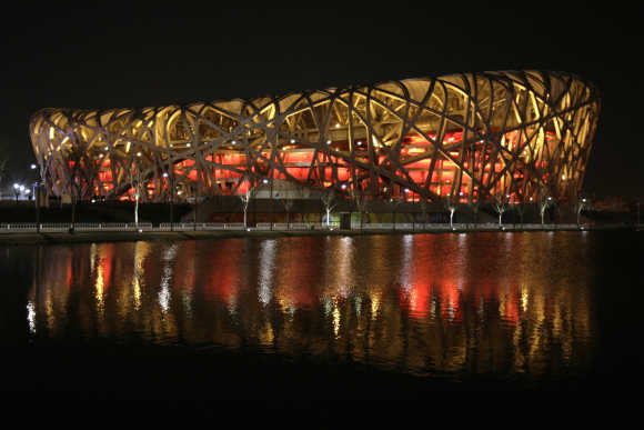 National Stadium, also known as 'Bird's Nest', is seen before Earth Hour in Beijing.