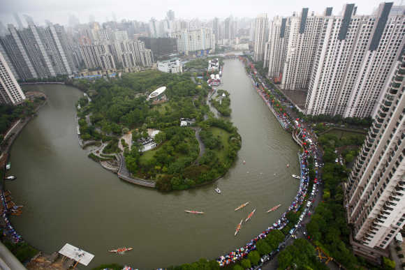 Aerial view shows boats participating in dragon race on Suzhou river in Shanghai.