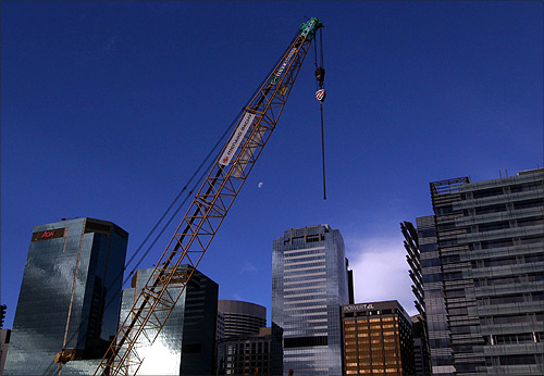 A crane is seen over Sydney's skyline at a construction site in central Sydney.