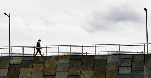 A man strolls the esplanade along the Potomac River at the recently opened Long Bridge Park in Arlington, Virginia.
