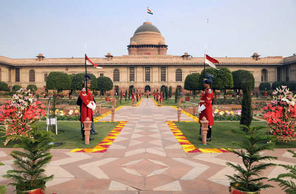 Guards stand in Mughal gardens surrounding Rashtrapati Bhavan in New Delhi.