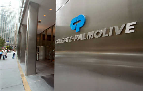 People pass the entrance of Colgate-Palmolive World headquaters in New York City.