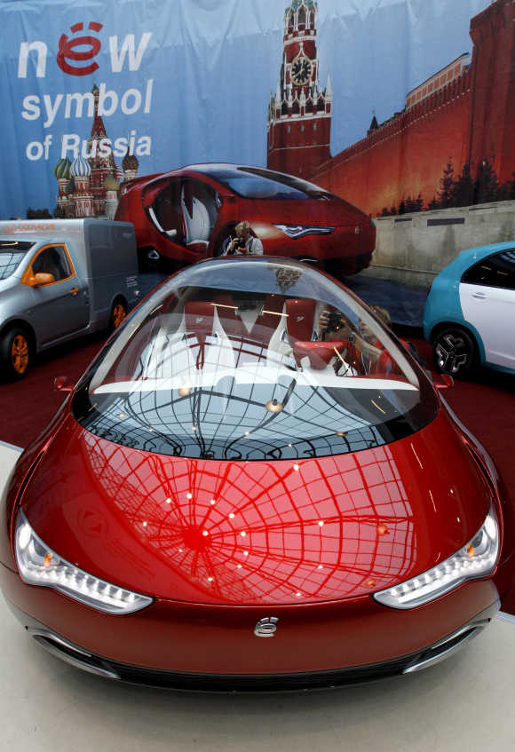 Visitors view a hybrid concept car from Russian car manufacturer e-Auto shown for the first time to the Russian public in St Petersburg.