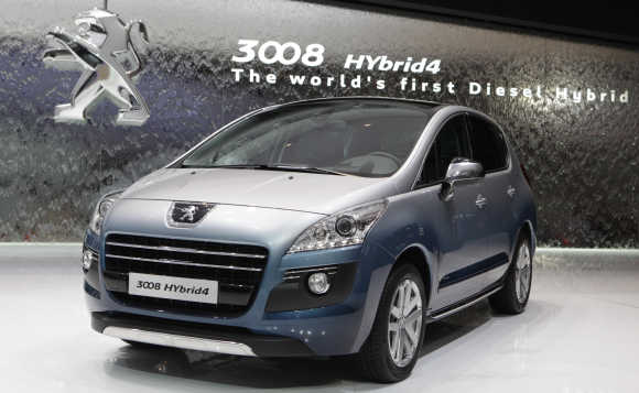 Peugeot 3008 Hybrid4 car is displayed in Geneva.