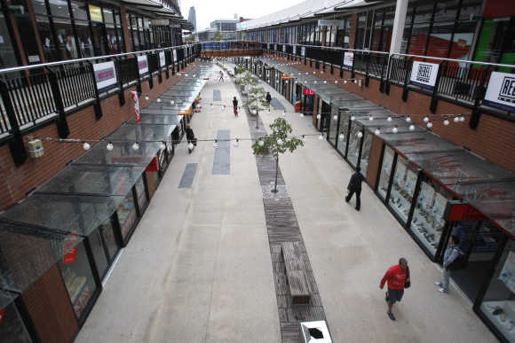 Shoppers walk through a complex in Melbourne.