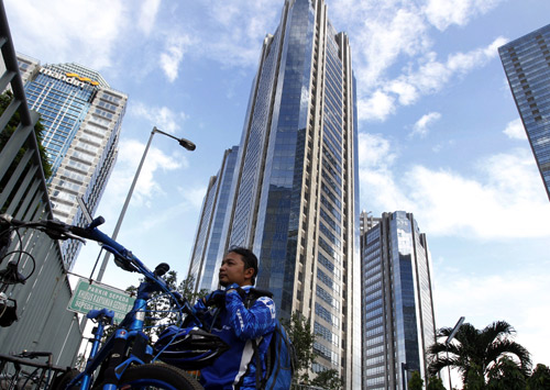 Eka Januar, 33, a manager of an Indonesian company, he arrives at a business district where he works in Jakarta.