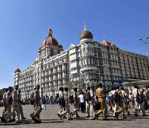 Policemen arrive for deployment at the Taj Mahal Hotel as part of security measures ahead of US President Barack Obama's visit in Mumbai.