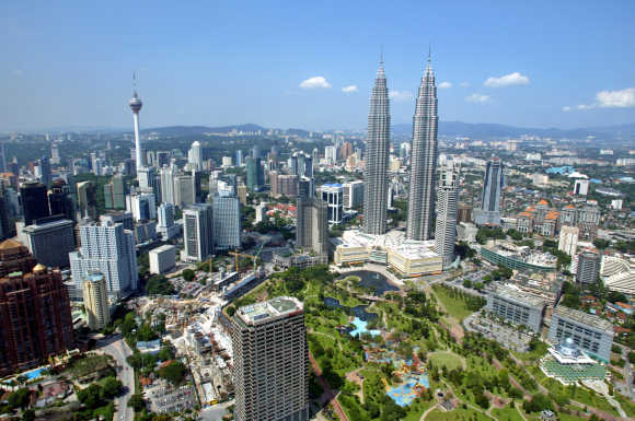 A view of Malaysia's landmark 452-metre Petronas Twin Towers and the 421-metre Kuala Lumpur Tower.