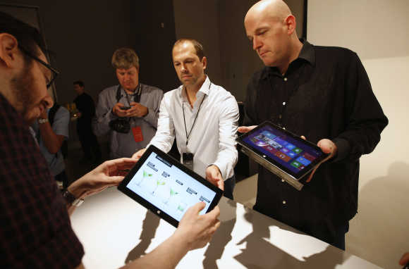 Microsoft representatives show the Surface tablet computer to members of the media in Los Angeles, California.