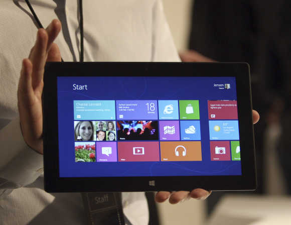 A Microsoft representative holds the Surface tablet computer in Los Angeles, California.