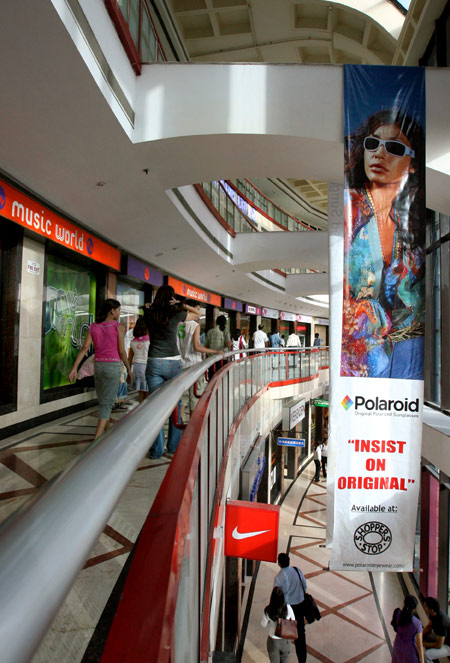 People wander around a shopping mall in New Delhi.