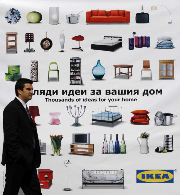 Man walks past advertisement of Swedish flat-pack furniture maker Ikea in Sofia, Bulgaria.