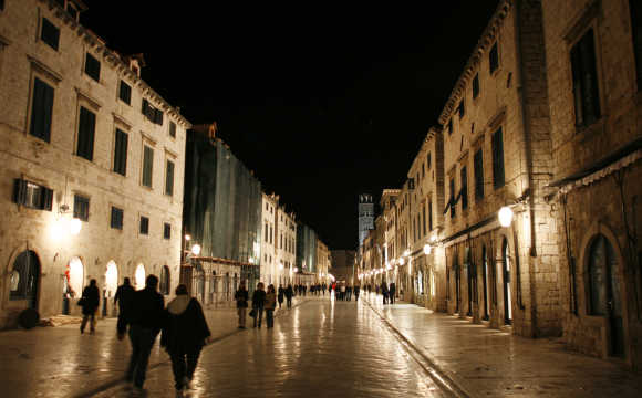People walk through streets of Croatia's most popular Adriatic destination of Dubrovnik.