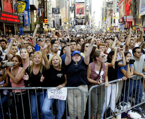 Thousands of people gather in Times Square to celebrate the opening day of NFL season in New York.